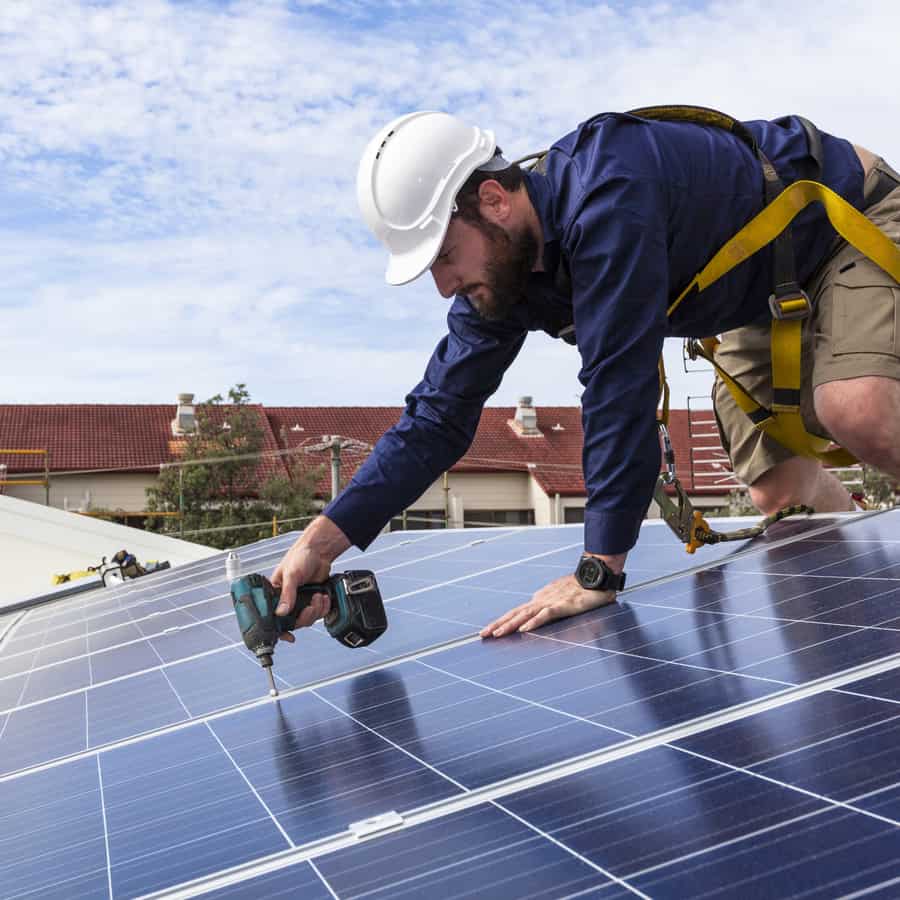 Solar Panel Worker Installing Solar Panels in Orlando, FL